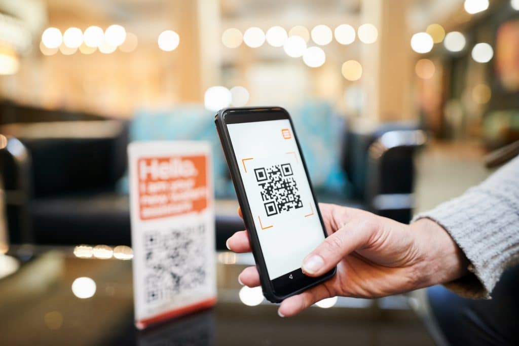 Person scanning QR code
